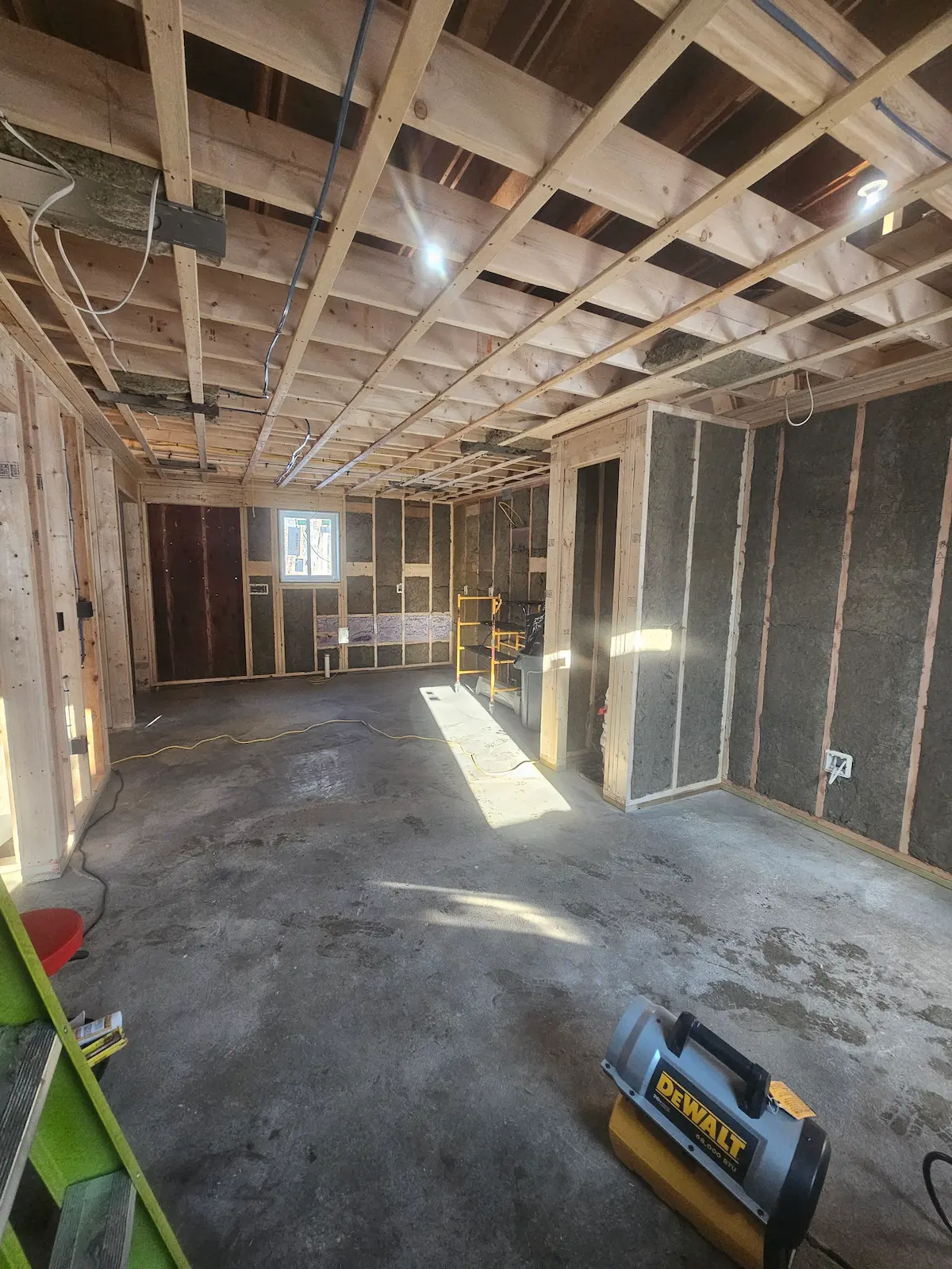 In law addition at framing stage showing lviing room and kitchen area in Merrimack NH